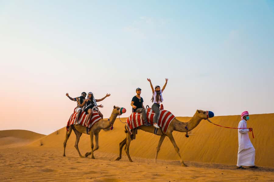 Dubai: Quad Bike Safari, Camels & Al Khayma Camp BBQ Dinner - Sandboarding and a photo stop: short, sweet, and very Dubai