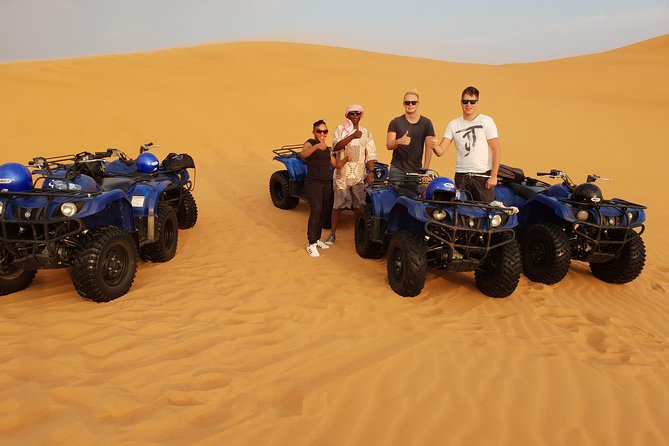 Dubai: Quad Bike Safari, Camels, & Camp with BBQ Dinner - Quad Biking Across Red Dunes: The Main Event