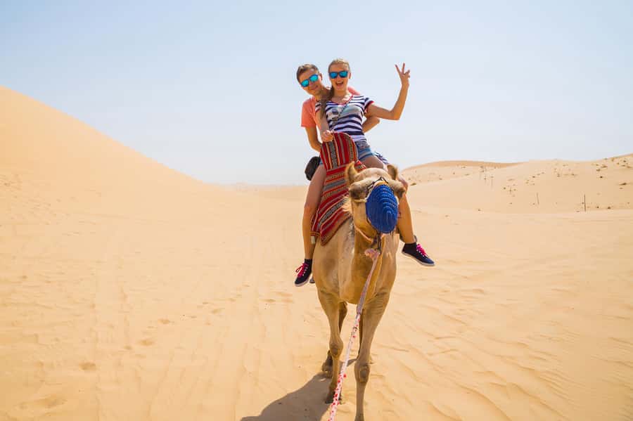 Dubai: Red Dunes Quad Bike with Sandboarding, Camels and BBQ - Entering The Lahbab Desert With Air-Conditioned Comfort First