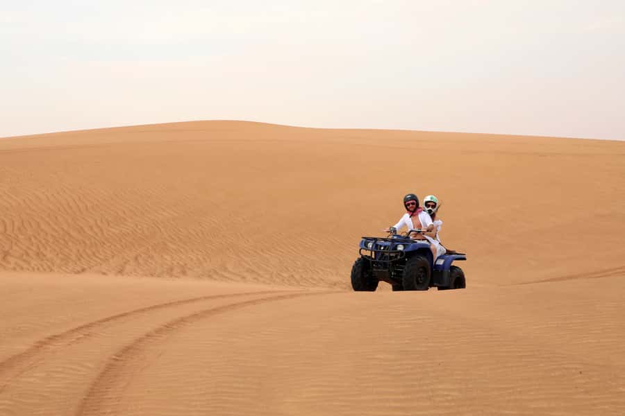 Dubai: Red Dunes Quad Bike with Sandboarding, Camels and BBQ - Price and Value: What $65 Buys You in Real Terms