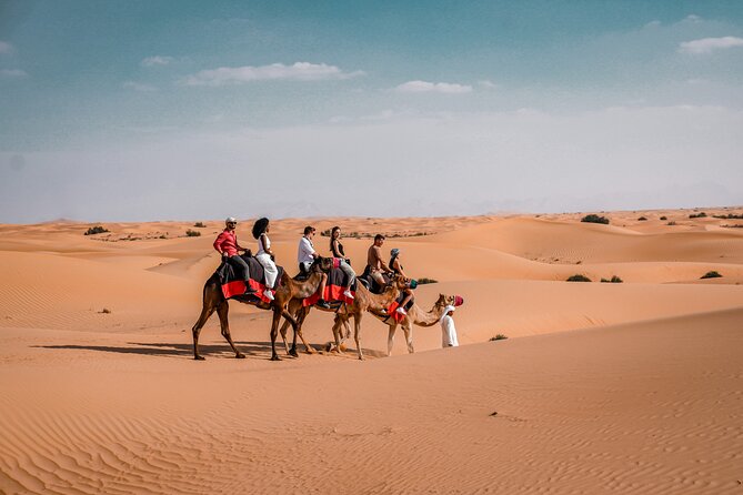 Dubai Red Dunes Safari: Dune Bashing, Camel Ride & Breakfast - Camel ride and sandboarding at the camp