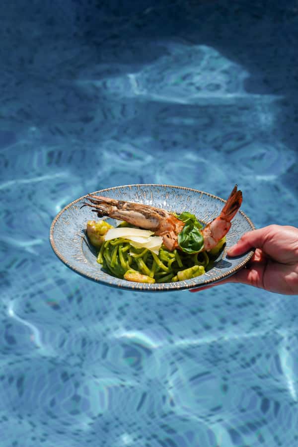 Dubai: Riva Beach Club Pool and Beach Day Pass - Palm Jumeirah setting with Arabian Gulf, Burj Al Arab, and Downtown views