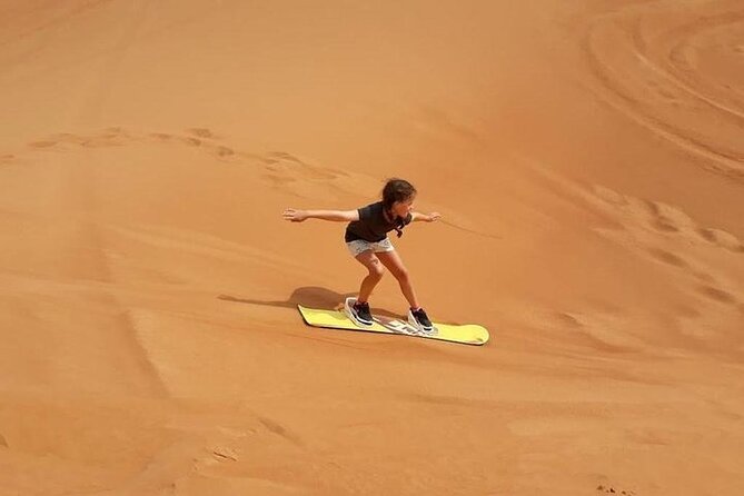 Dubai Self-drive Quad Bike, Sand Boarding, Camels & Refreshments - Sandboarding: the fun after the adrenaline