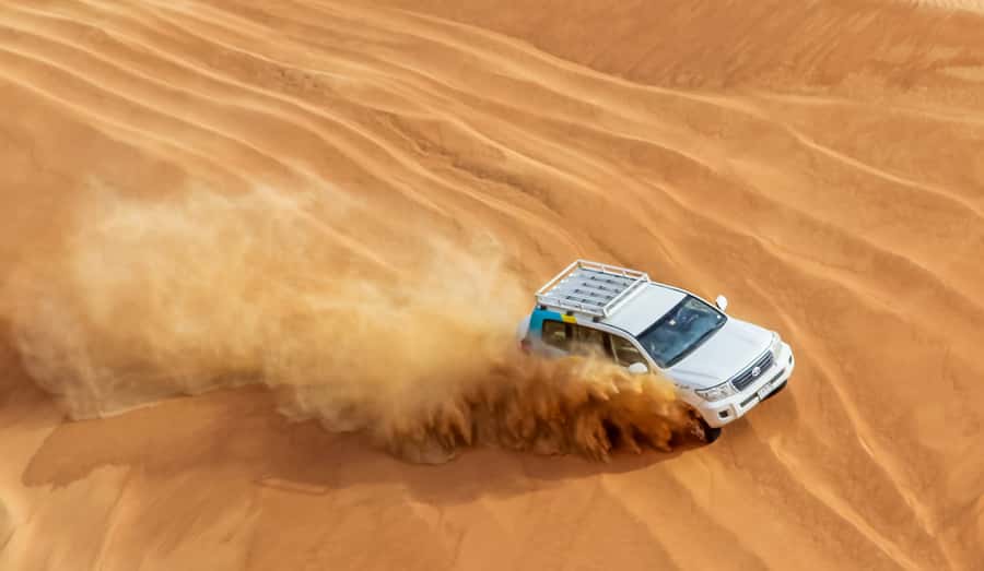Dubai Sunrise Desert Camel Trek with Breakfast - Dune bashing and red-sand drives, a quick thrill not a full rodeo