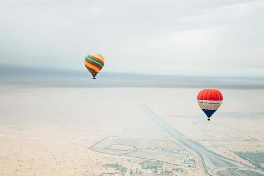 Dubai: Sunrise Hot Air Balloon Tour Over the Desert - The Balloon Flight: Sunrise Light, 4,000 Feet, and That Quiet Wow
