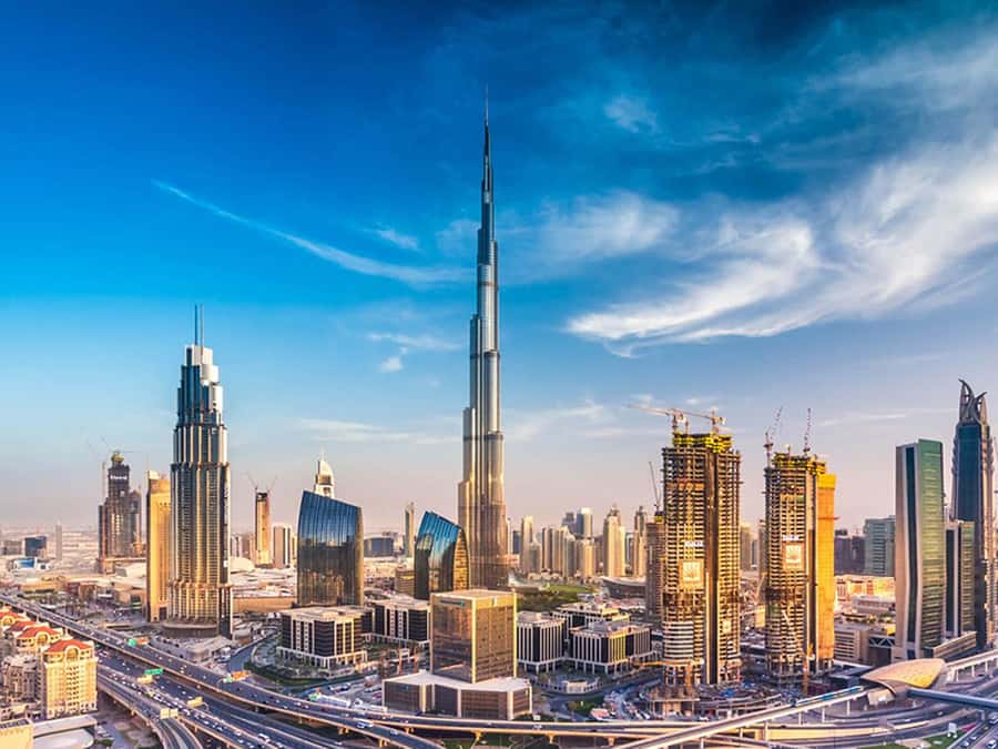 Dubai: Traditional and Modern Tour with Burj Khalifa Ticket - Abra across the water, then the Spice and Gold Souks