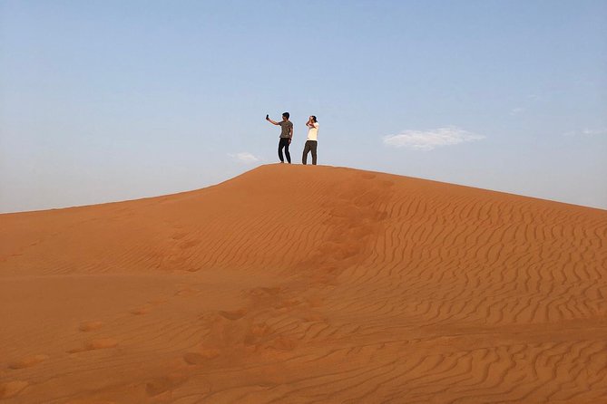 Dubai: Unique SUNSET 4WD Red Dunes Safari - Sandboarding and Camel Ride: Fast Fun Plus a Slow-Motion Reset