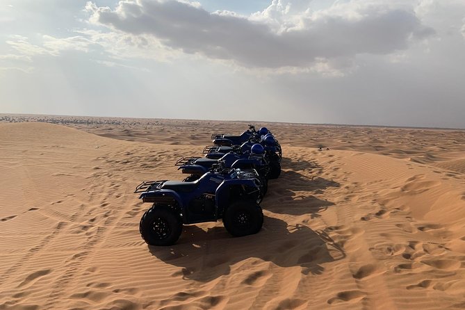 Dubai: Unique SUNSET Quad Bike Red Dunes Safari - Camel Ride for the Slower Side of the Desert