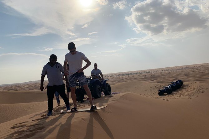 Dubai: Unique SUNSET Quad Bike Red Dunes Safari - Desert Camp Dinner: BBQ, Shows, and Henna at Night