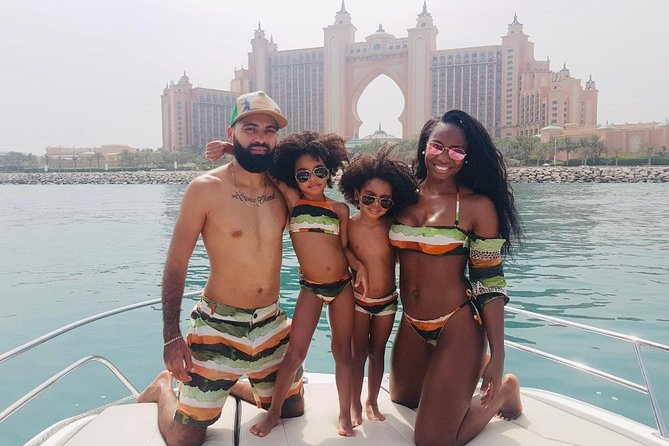 Dubai Yacht Sea escape Cruise, Swim, Tan & Sightsee! - Music, drinks, and photo help: the service details that drive the 5-star feeling