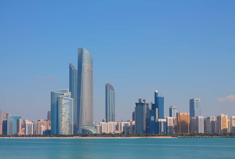 From Dubai: Abu Dhabi Grand Mosque Visit & Theme Park Option - Choosing your one add-on: Ferrari World, Louvre Abu Dhabi, or Warner Bros