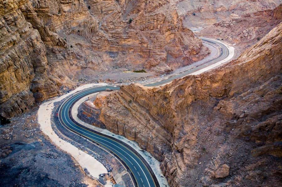 From Dubai: Jabel Jais High Mountain Tour with Transfers - The Main Jebel Jais Visit: Photo Stops, Sightseeing, and Sunrise Timing