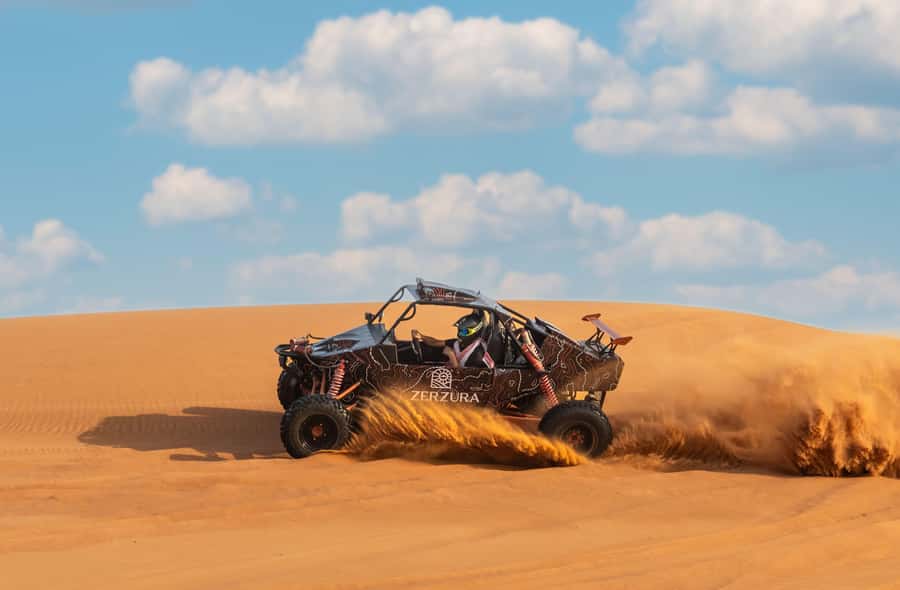 From Dubai: Zerzura Buggy Experience + Private Dinner - Zerzura: camels, welcome refreshments, and camp vibes