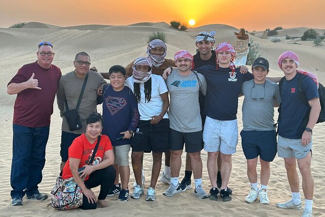 Guided Desert Safari with Dinner and Quad Biking in Dubai - Camel riding and sandboarding: sunset fun without the long wait