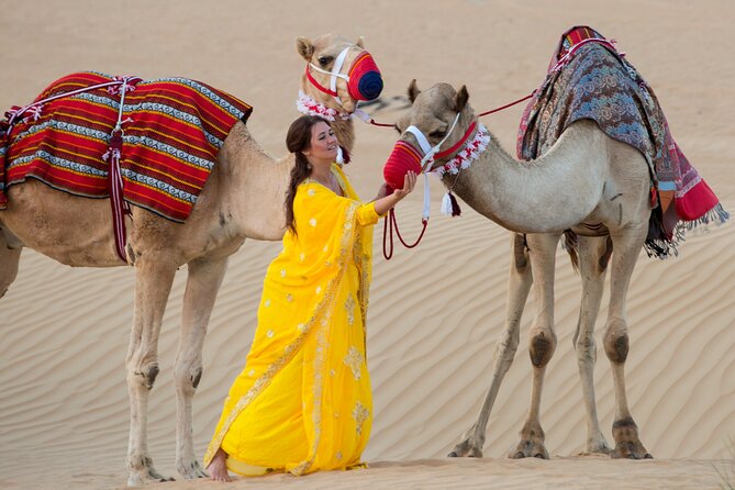 High Red Dunes with Camel Ride, Sandboarding, Falcon Show and VIP BBQ Dinner - Camel ride and henna: the classic desert photos, done right