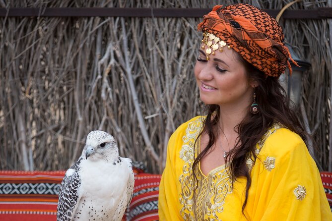 High Red Dunes with Camel Ride, Sandboarding, Falcon Show and VIP BBQ Dinner - Falcon show and stage performances: cultural flavor, with one seasonal note