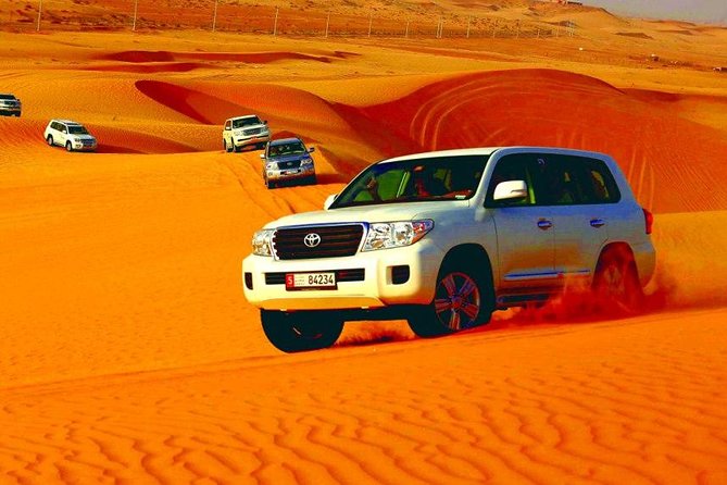 Morning Desert Safari Abu Dhabi with Camel Ride - Mid-desert sandboarding stop and view time
