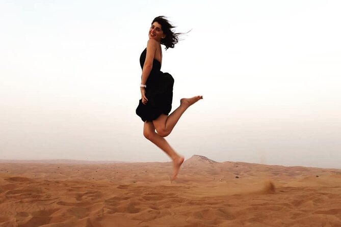 Morning Red Dunes Safari: Camel Ride & Sandboarding Adventure - Sandboarding and photo stops: where the desert turns into a playground