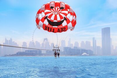 Parasailing in Dubai with Palm Jumeirah and JBR Beach views