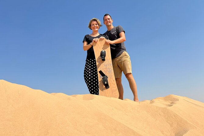 Private Abu Dhabi Sunset Desert Safari with Sand Boarding - Camel farm visit: Bedouin life, real camel contact, and photo time