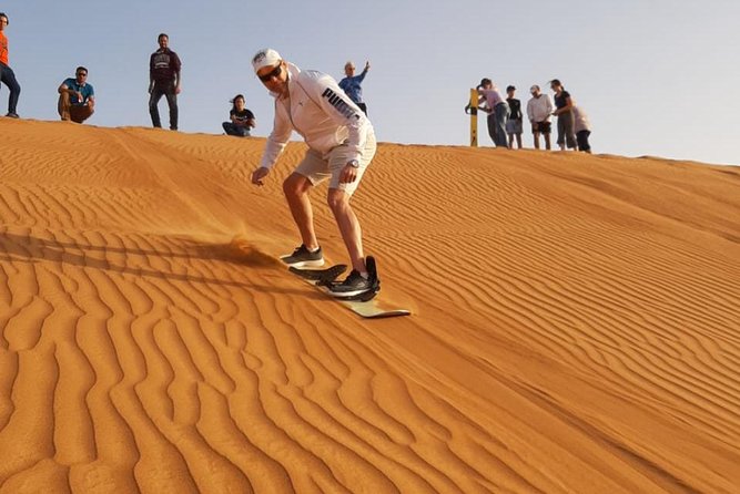 Private Desert Safari Red Dune with BBQ, Sand Boarding and Camel Ride - Tanoura and Belly Dancing at the Camp: Shows, Fire, Shisha, and Henna