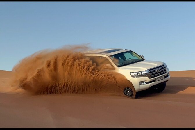 Red Dunes Desert Safari Dubai with Dinner Buffet, Show & Transfer - Camp time: camel ride, sand boarding, henna, and costume photos