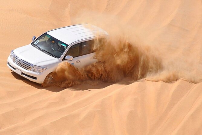Red Dunes Desert Safari with 4x4 Pick up & Drop, Camel ride, BBQ and Live shows - Live Shows and BBQ Dinner: What You Get After Sunset