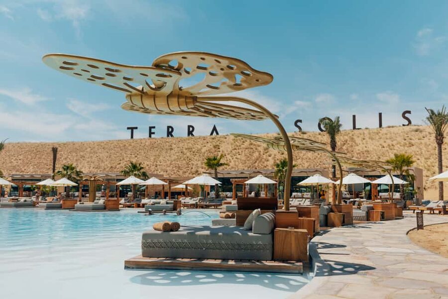 Terra Solis: Unwind and Re-Energize by the Pool - Poolside downtime, with DJ beats in the background
