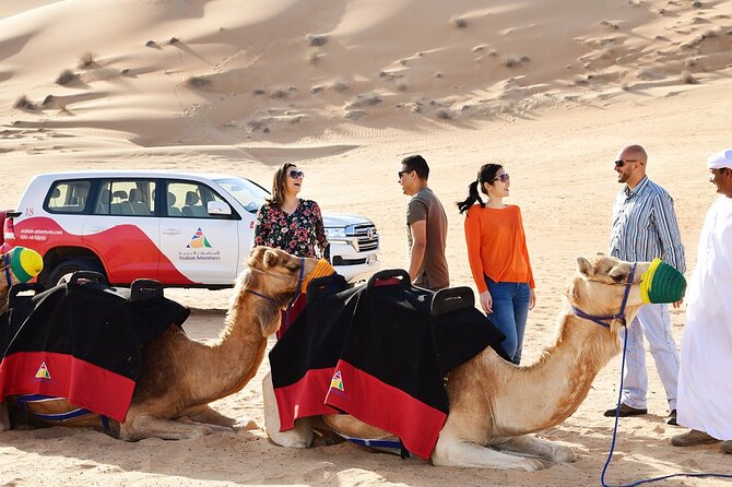 Thrilling Desert Safari Dubai Adventure with Sand Boarding and Barbecue Dinner - Camel Ride, Henna, and Arabic Dress Photo: Camp Activities That Feel Theatrical