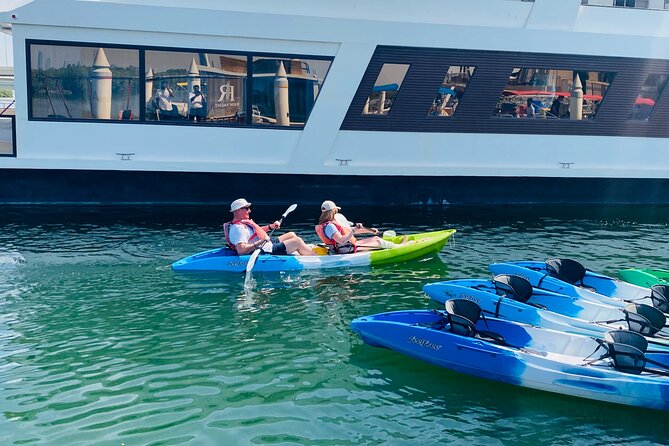 Two Hours Guided Kayaking Tour Reem Central Park Abu Dhabi - Beach stop, swimming time, and the optional surfing lesson