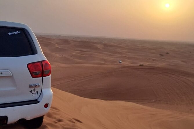 VIP Dubai Desert Safari with Quadbike,Sandboarding & BBQ dinner - Adventure Planet camp night: camel ride, henna, costumes, and live shows