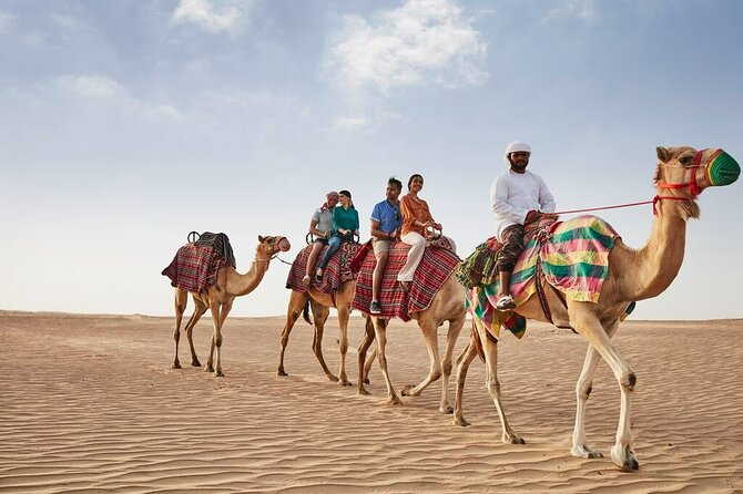 VIP Dubai Sunset Desert Safari: Camel Ride, BBQ, Unlimited Spirit - Bedouin camp moments: camel ride, henna, sandboarding, and shisha